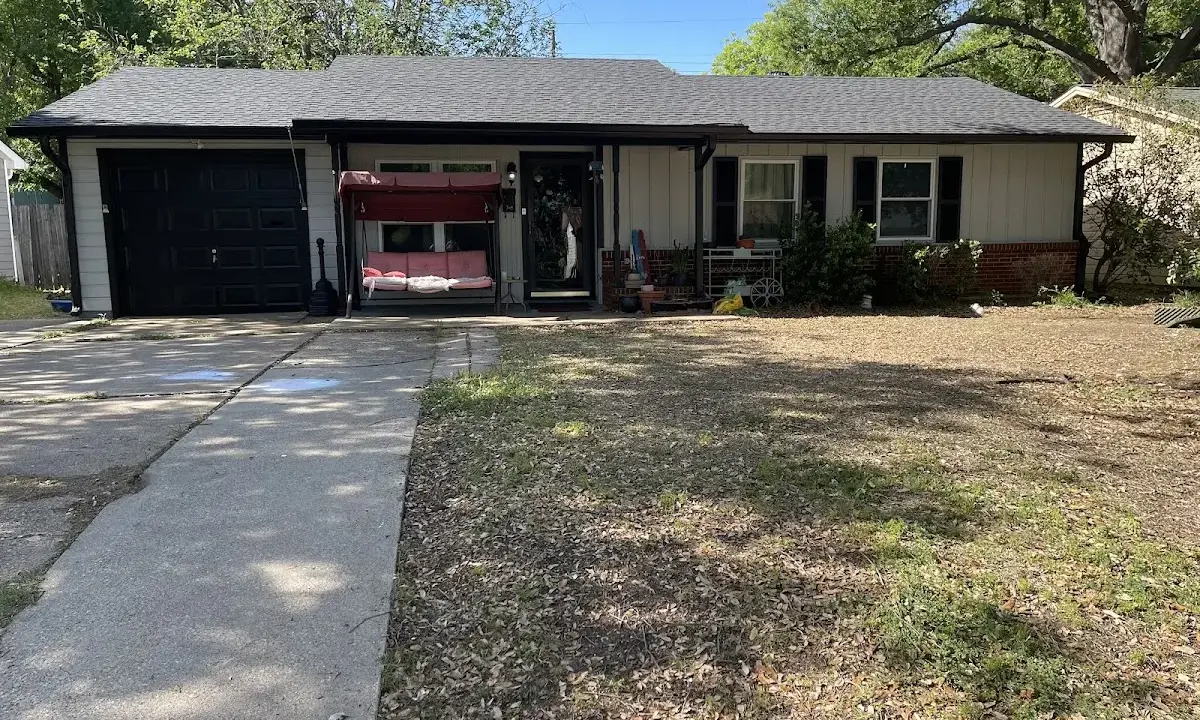 Asphalt Shingle Roof Repair crew at work on a residential roof in New Carrollton